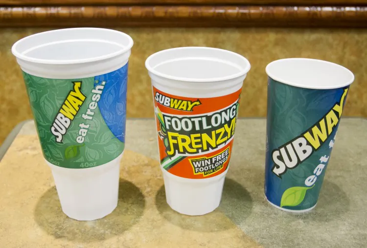 A line of drink cups ranging from 7 ounces to 64 ounces with their corresponding sugar content, at a briefing at City Hall when the proposed ban was first announced in May 2012. (Christian Watjen/The Epoch Times)