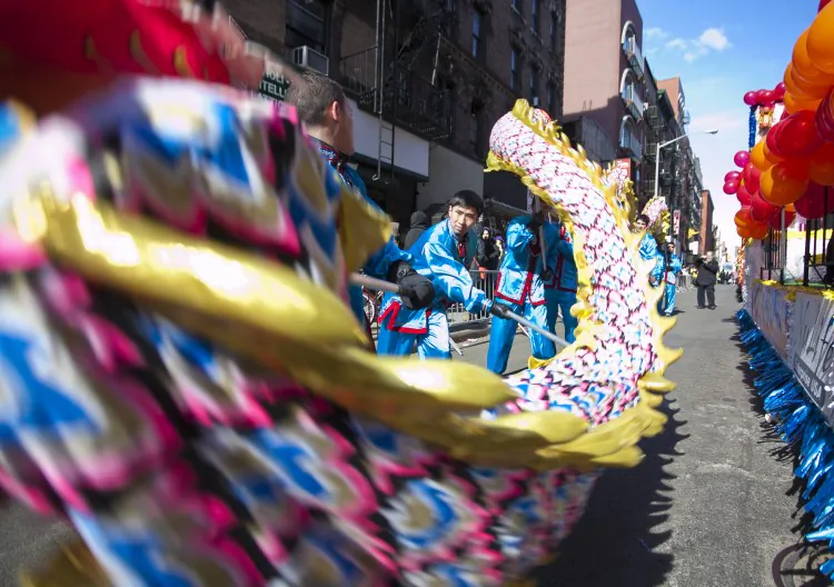 The Falun Dafa dragon team celebrate in Manhattan's Chinatown on Feb. 17 despite being denied by the parade organizers. (Samira Bouaou/The Epoch Times)