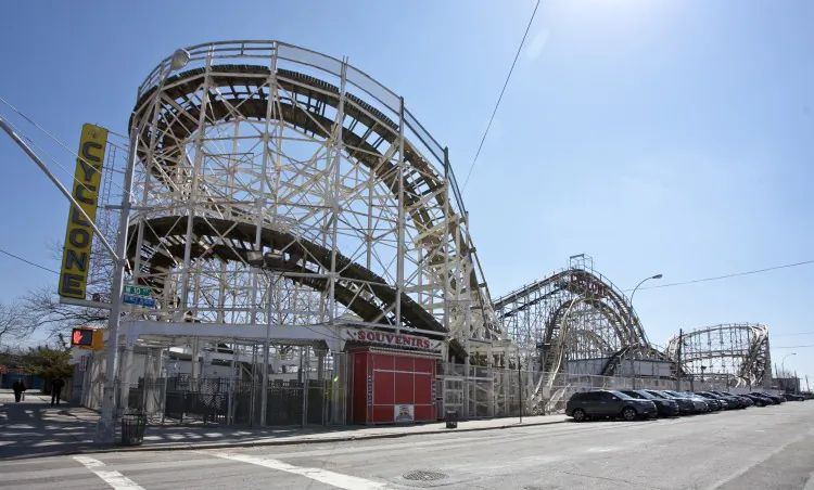 Riders on Coney Island's Cyclone roller coaster scream as they head down the hill in August 2011. Cyclone will open for its 86th season on Sunday, March 24, 2013. (Jim McDonnell/Luna Park)