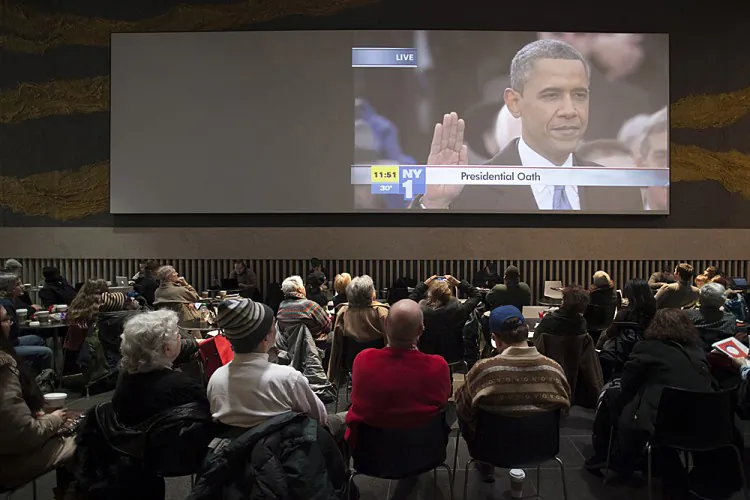 Helen Rosenthal watched the presidential inauguration along with a crowd of more than one hundred people in Midtown's David Rubenstein Atrium on Jan. 21, 2013. (Deborah Yun/The Epoch Times)