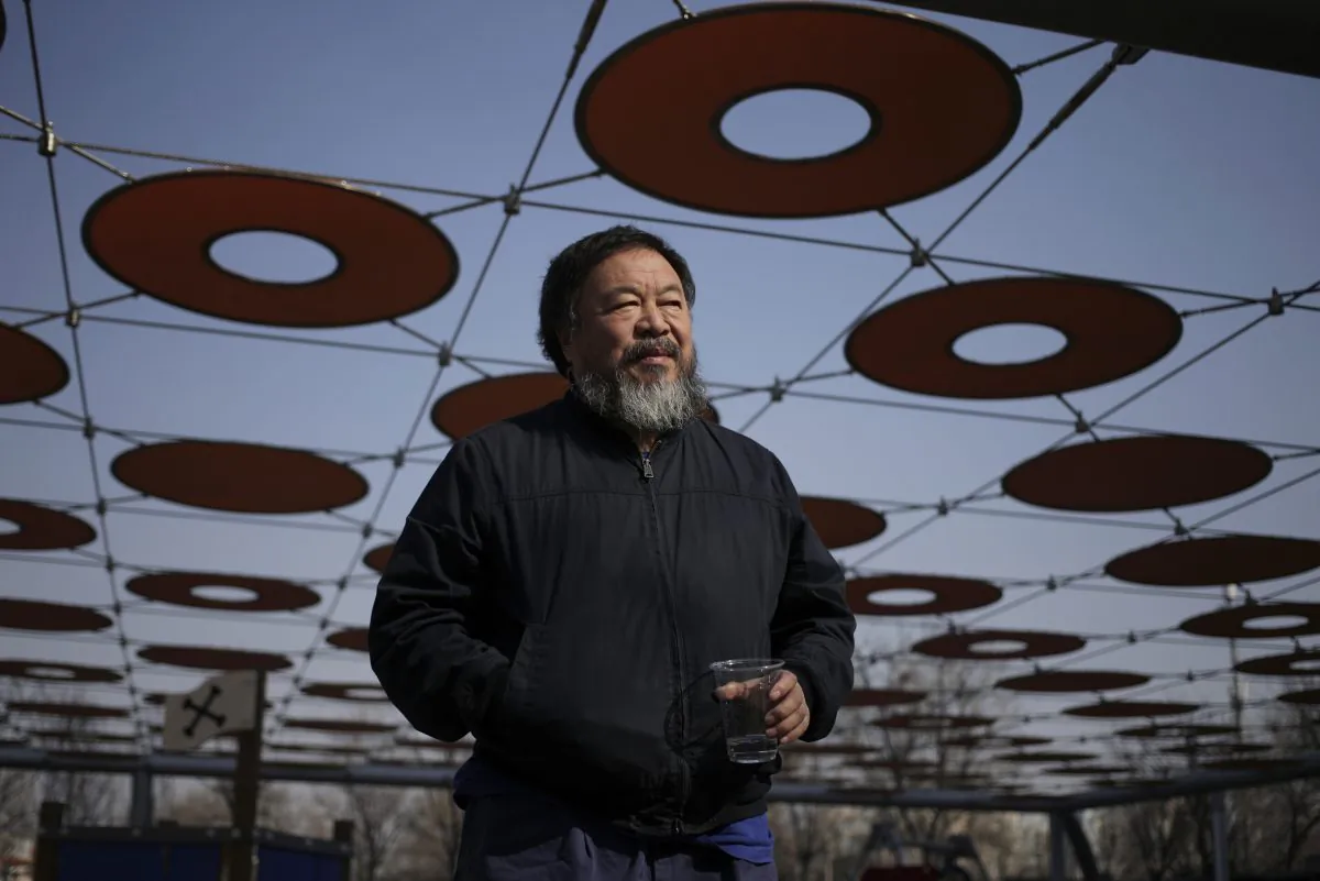 Chinese dissident artist Ai Weiwei walks near a playground outside a shopping mall in Beijing on March 24. (Andy Wong/AP Photo)