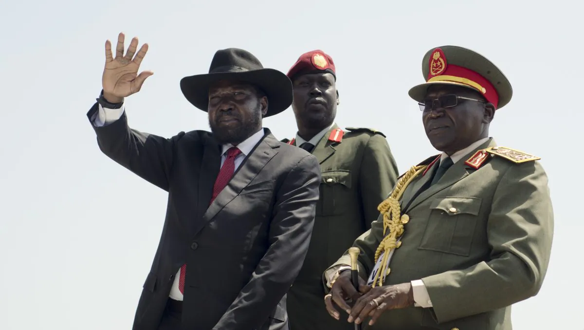 South Sudan's President Salva Kiir (L) accompanied by Army Chief of Staff Paul Malong Awan (R) during an Independence Day ceremony in the capital Juba, South Sudan, on July 9. South Sudan marked four years of independence from Sudan on Thursday, but the celebrations were tempered by concerns about ongoing violence and the threat of famine. (Jason Patinkin/AP)