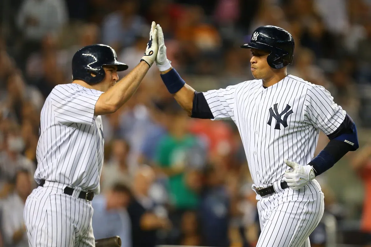Alex Rodriguez (R) has surprised nearly everyone with his hitting this year. (Mike Stobe/Getty Images)
