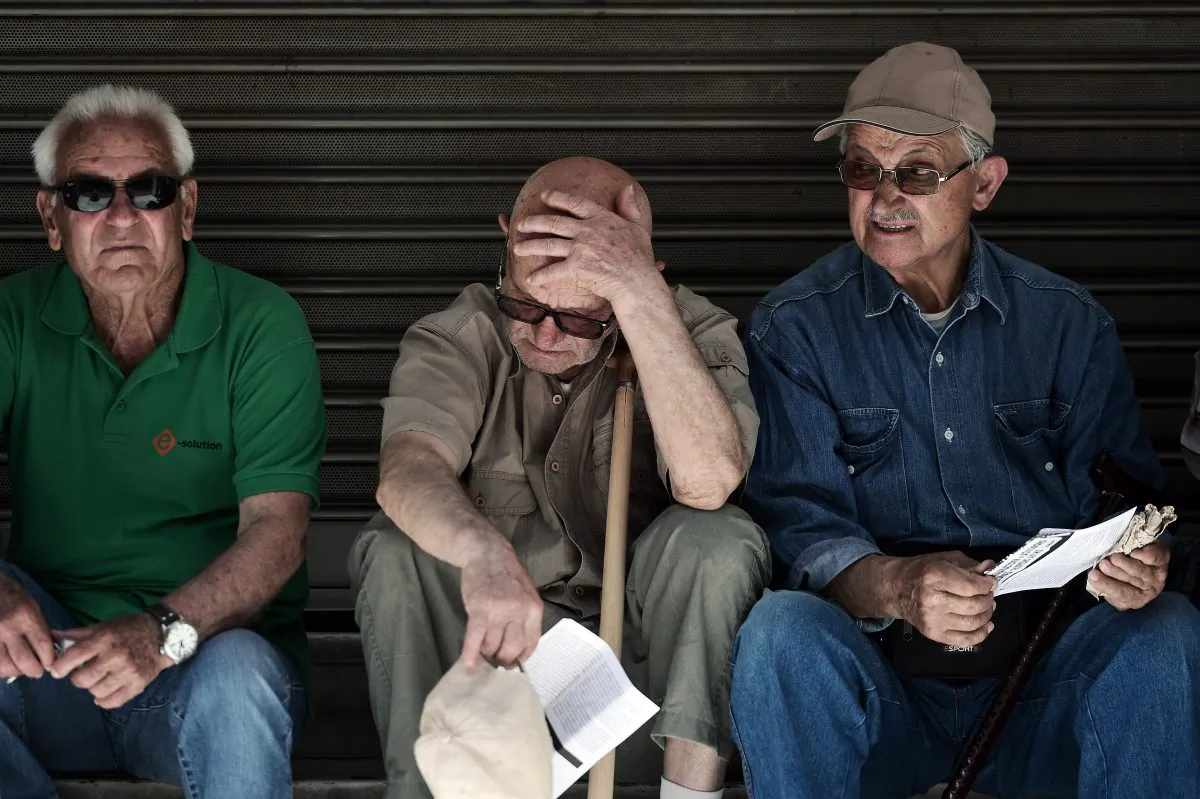 Pensioners outside the Ministry of Health in Athens during a 24-hour strike by health workers and doctors demanding funds and additional staff, on May 20, 2015. (Louisa Gouliamaki/AFP/Getty Images)