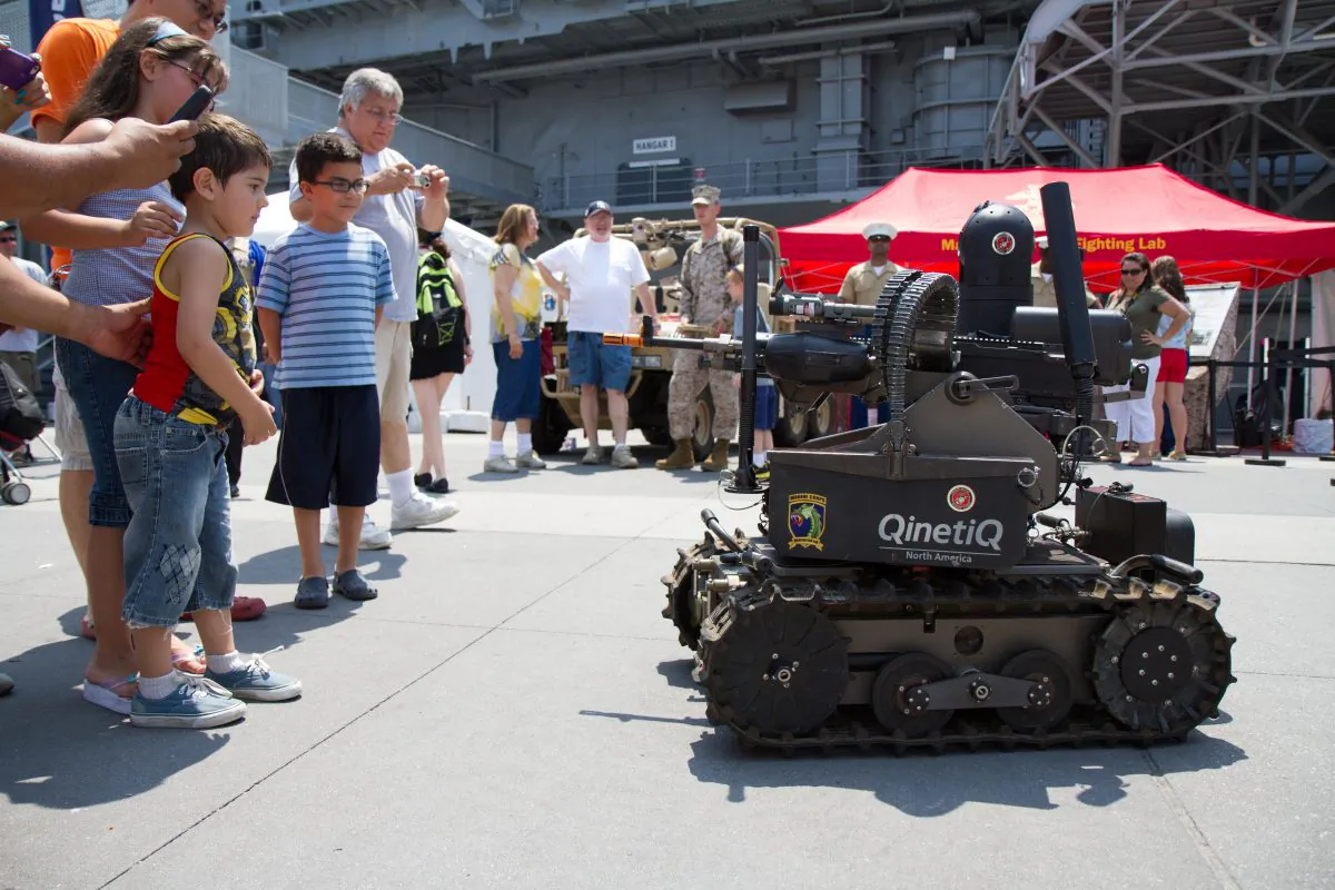 An autonomous weapon military robot preforms demonstrations for spectators at the Memorial Service on the Intrepid on May 28, 2012. (Benjamin Chasteen/Epoch Times)