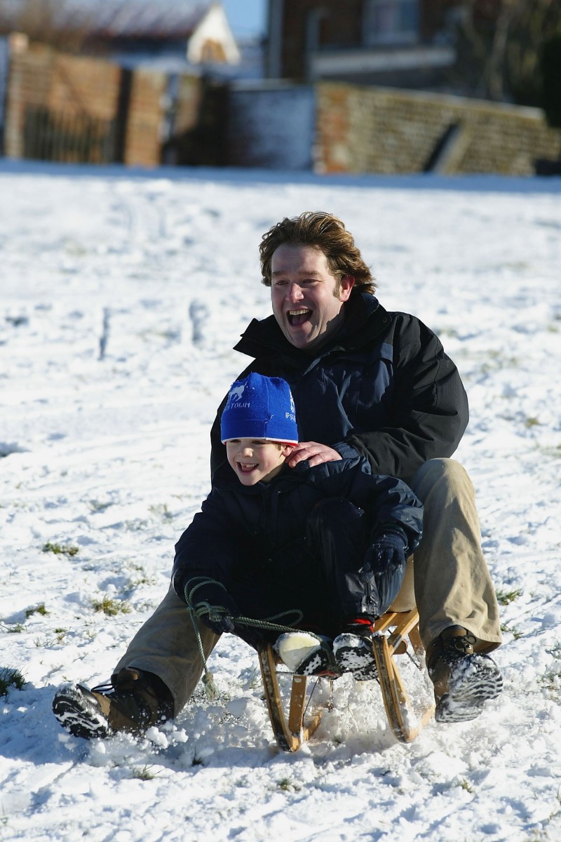 Cold weather and snow can provide dozens of fun family activities that promote togetherness. (Jamie McDonald/Getty Images)