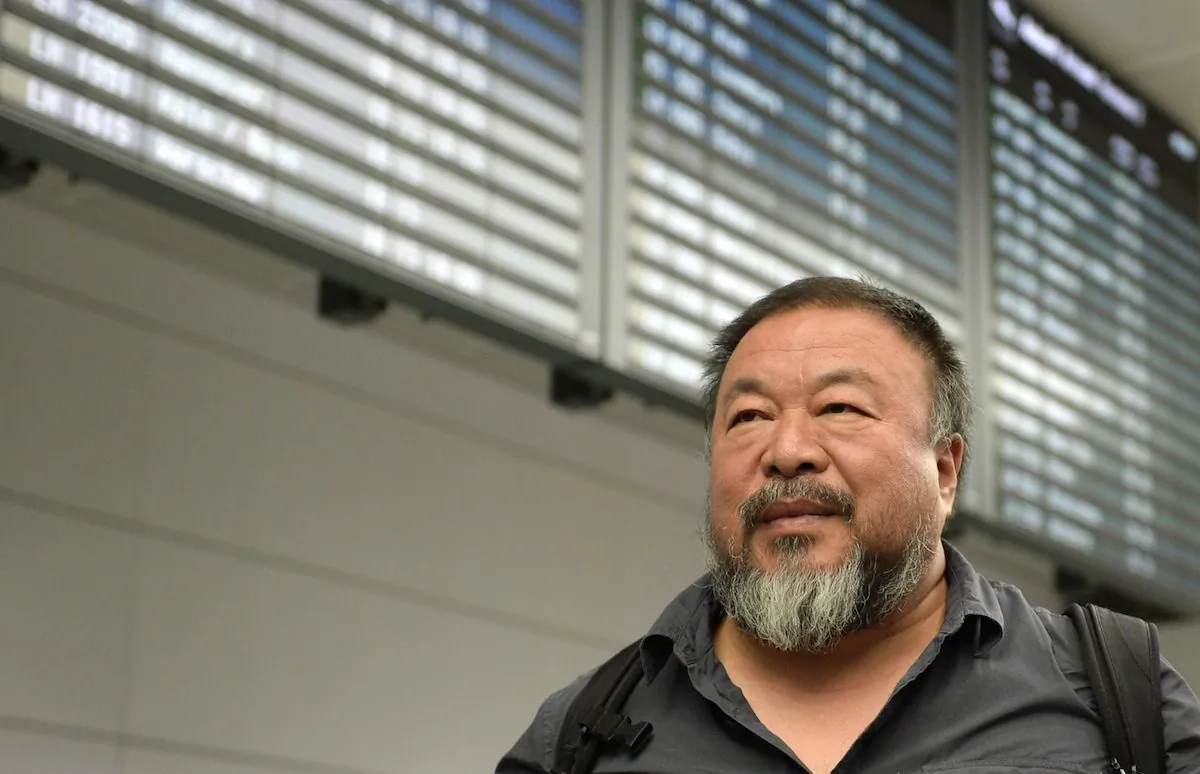Chinese artist Ai Weiwei gives an interview as he leaves the Franz-Josef-Strauss airport in Munich, southern Germany, after his arrival from China on July 30, 2015. (Christof (Stache/AFP/Getty Images)