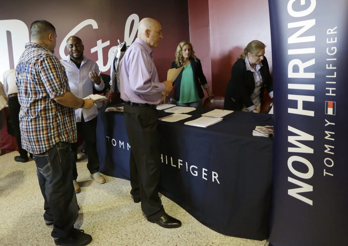 In this photo taken June 10, 2015, job seekers attend a job fair in Sunrise, Fla. The Labor Department releases weekly jobless claims on Thursday, July 30, 2015. (AP Photo/Alan Diaz)