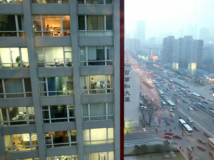 A highrise office building in Beijing, 2004. The trend to emigrate has slowly spread from the rich to the middle-class. (Goh Chai Hin/AFP/Getty Images)