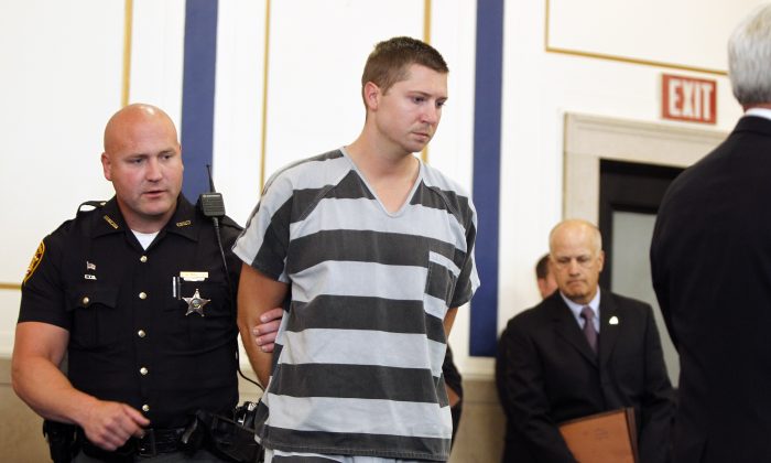 Former University of Cincinnati police officer Ray Tensing enters Hamilton County Common Pleas Court to be arraigned on murder charges July 30, 2014 in Cincinnati, Ohio. (Mark Lyons/Getty Images)