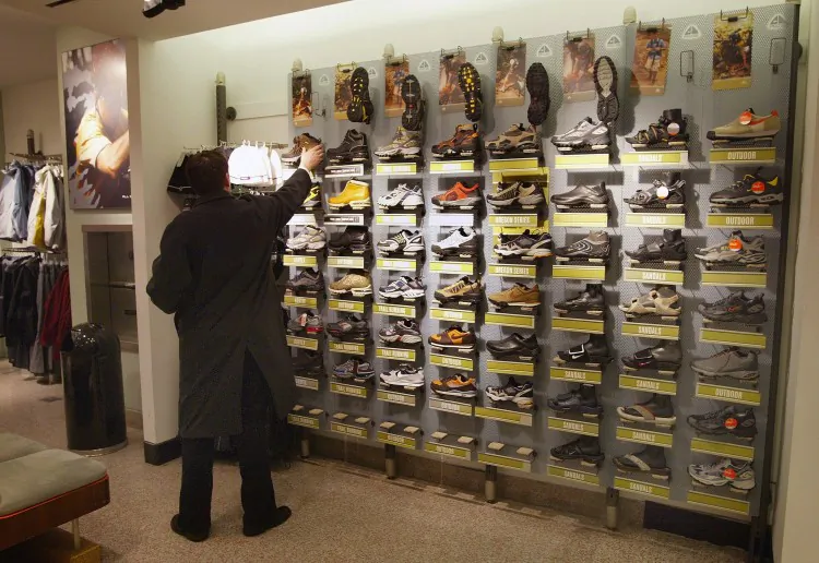 A shopper looks at shoes inside a Niketown store in Chicago, Ill., in this file photo. Under the proposed Athletic Shoe Retailer Tax Act, an extra 25 cents per athletic shoe sold in the state would go to support the Illinois YouthBuild Coalition, and the extra tax is estimated to bring $3 million dollars to the fund. (Tim Boyle/Getty Images)