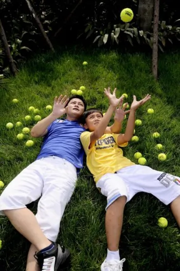 Li Chengpeng and his son in a sponsorship ad for the boy's tennis talent by a nonpolitical company promoting healthy interaction between parents and children. Authorities banned the image from being printed in newspapers. (Li Chengpeng's blog)