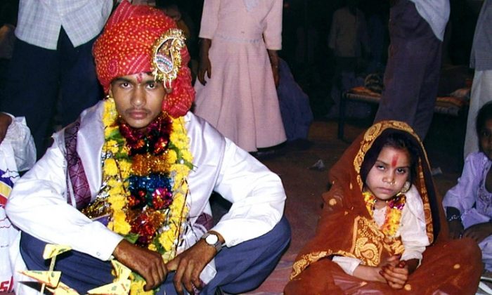 A 16 year old boy waits to be married to a much younger girl during a mass child marriage ceremony in Indore, India, on May 15 2002. (AFP/Getty Images)