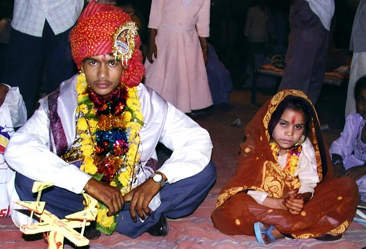 A 16 year old boy waits to be married to a much younger girl during a mass child marriage ceremony in Indore, India, on May 15 2002. (AFP/Getty Images)