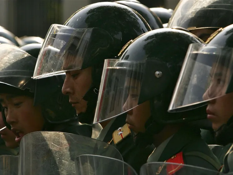 Chinese riot police. Riot police using tear gas, stun grenades, and clubs, dispersed protesters in Shifang City.  (Andrew Wong/Getty Images)