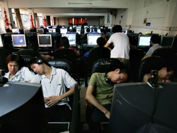 Chinese youngsters sleep at an internet cafe. (Cancan Chu/Getty Images)