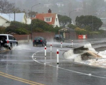 Drivers on Marine Parade in Wellington struggle with strong winds during a storm in 2004. Strong gusts are forecast for Wellington, and severe weather warnings issued for other parts of New Zealand. (Photo by Ross Setford/Getty Images)
