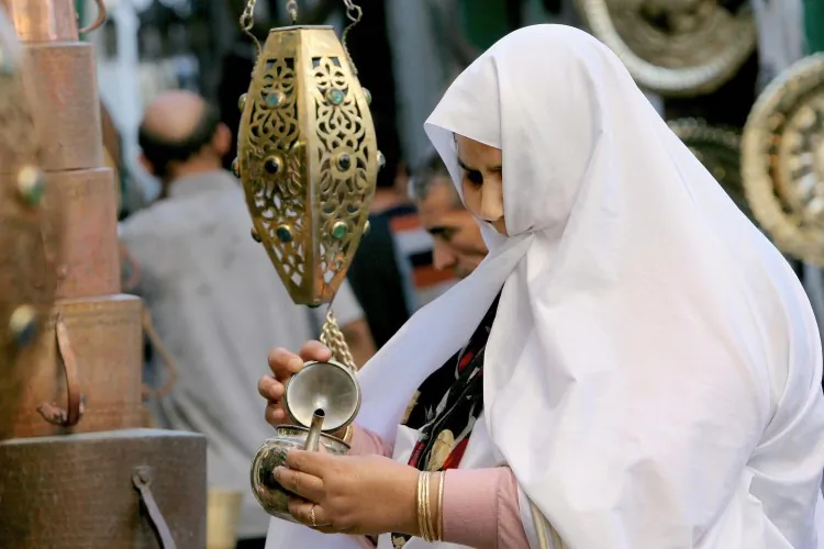 A women checks a hand-made teapot at a market. Redbush tea's reputation as a healthy alternative to regular tea is fast spreading amongst tea lovers worldwide. (Khaled Desouki/AFP/Getty Images)