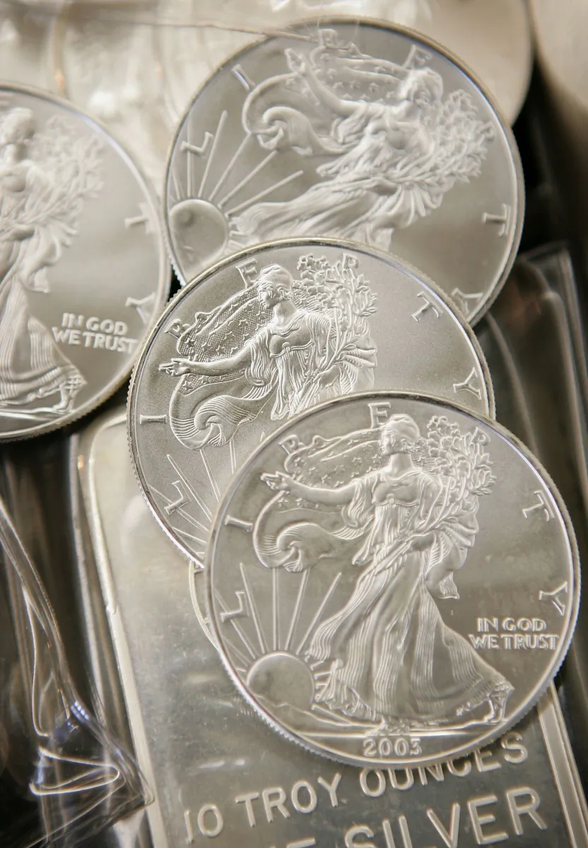 Silver bullion and coins are offered for sale at the Chicago Coin Company May 11, 2006, in Chicago, Ill. Researchers say that the available silver supply is limited, and there will be no in-ground silver available in about 25 to 30 years. (Scott Olson/Getty Images)
