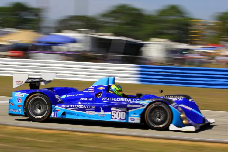 Tristan Nunez in the #500 Visit Florida Performance Tech Oreca roars towards Turn Thirteen in the opening laps of the 2013 Sebring 12 Hours. (James Fish/The Epoch Times)
