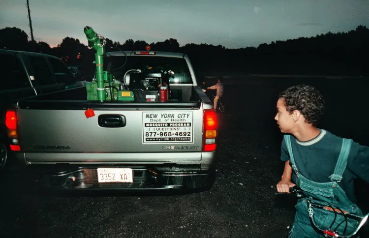 Vinny Damilo of Staten Island looks over a mosquito sprayer in this file photo from 2000 on Staten Island, N.Y. The Health Department has been spraying throughout the city as the mosquito population grows and West Nile Virus becomes more prevalent. (Chris Hondros/Newsmakers)