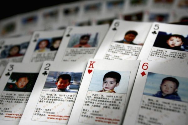 BEIJING, CHINA: The "missing children playing cards" are displayed by Shen Hao, the founder of a missing person website, the www.xrqs.com, on March 31, 2007 in Beijing, China. The cards show photographs, informations of 27 missing children and Shen Hao plans to hand out them free to the public security departments, civil affairs bureaus and residents, in areas notorious for child trafficking.