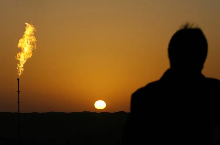 Sunrise over the Tazhong Oilfield in the Taklamakan Desert, in China's Xinjiang Province. (Frederic J. Brown/AFP/Getty Images)