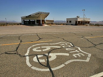 HISTORIC ROUTE 66: Signs of neglect can be seen even on such a historic highway as Route 66, near an abandoned gas station (L) and Cafe on June 16, 2007 in Ludlow, California. (David McNew/Getty Images)