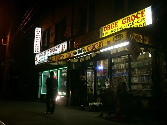 An evening scene outside of a bodega grocery store. (Spencer Platt/Getty Images)