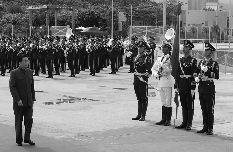 Chinese Communist Party leader Hu Jintao inspects the People's Liberation Army Garrison during a visit to the Stonecutters Naval Base in Hong Kong on June 30, 2007. (Mike Clarke/Getty Images)