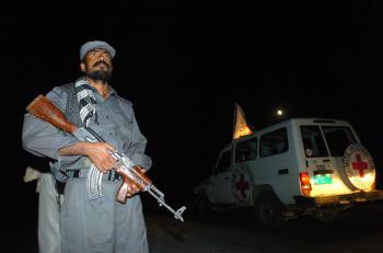 A Red Cross vehicle passes a guarded checkpoint in Afghanistan as it transports South Korean hostages released by the Taliban back to safety, in this file photo from August 2007. The International Committee of the Red Cross said Wednesday that a rapid inc (Shah Marai/AFP/Getty Images)