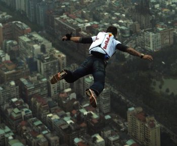 Felix Baumgartner, Austrian base jumper, makes a jump off the world's tallest completed building, the 508-meter high Taipei 101 Tower, Dec. 12, 2007 in Taipei,Taiwan. Later this year, Baumgartner plans to break the 50-year-old altitude record by jumping 120,000 feet. (Joerg Mitter/Getty Images)