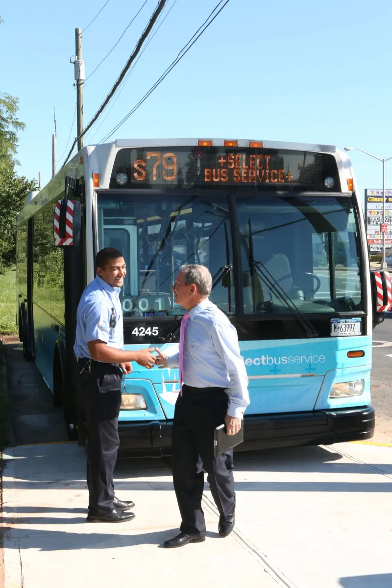 Mayor Michael Bloomberg (R) shakes hands with a bus driver next to the S79SBS bus in Staten Island on Thursday. The new express bus service will cut the number of stops from 80 to 22 end-to-end on Hylan Boulevard’s S79 route. (Courtesy of the Mayor’s Office)
