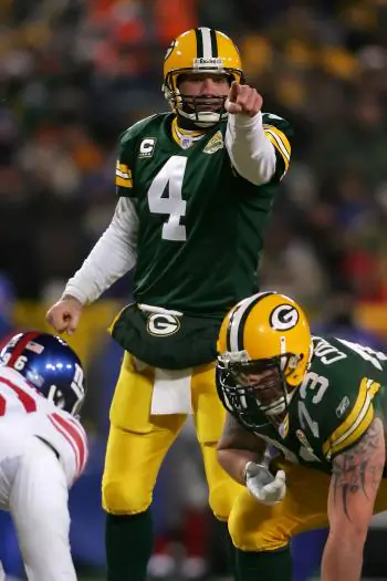Brett Favre takes charge in last year’s playoff thriller against the New York Giants. (Jonathan Ferrey/Getty Images)