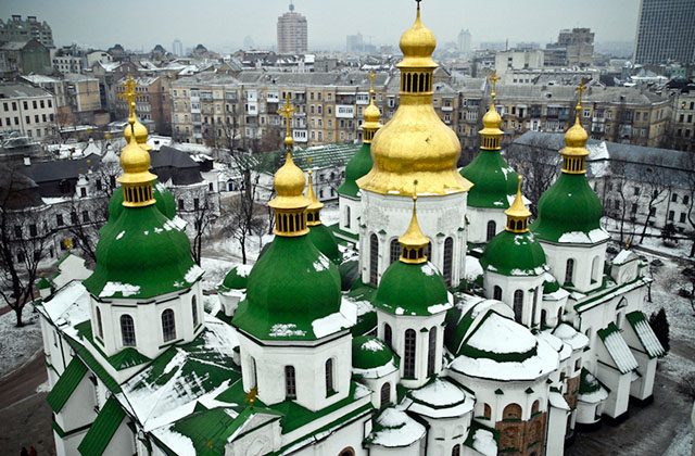 The Fresco St. Sophia condo project is being erected near the historic St. Sophia Cathedral, in historic Kyiv on June 20. The foundations of the old building are being damaged by the new project. (Eugene Dovbush/The Epoch Times)