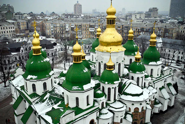 The Fresco St. Sophia condo project is being erected near the historic St. Sophia Cathedral, in historic Kyiv on June 20. The foundations of the old building are being damaged by the new project. (Eugene Dovbush/The Epoch Times)