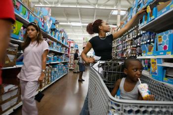 DILEMMA: Shoppers browse at a Wal-Mart Store in North Miami, Fla. The company was hit with the largest class-action employee discrimination lawsuit in U.S. corporate history. (Joe Raedle/Getty Images)