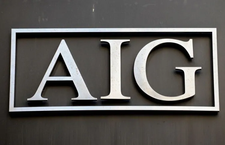 Logo of American International Group Inc. (AIG) outside its office in lower Manhattan in this file photo. AIG benefited greatly from Treasury’s gift of $17.7 billion, boosting its net earnings to $19.9 billion during the fourth quarter of 2011. (Stan Honda/AFP/Getty Images)