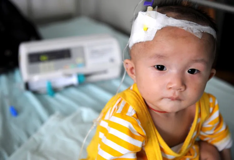 A baby who suffers from kidney stones after drinking tainted milk powder, gets IV treatment at the Chengdu Children's Hospital on Sept. 22, 2008 in Chengdu of Sichuan Province, China. (China Photos/Getty Images)