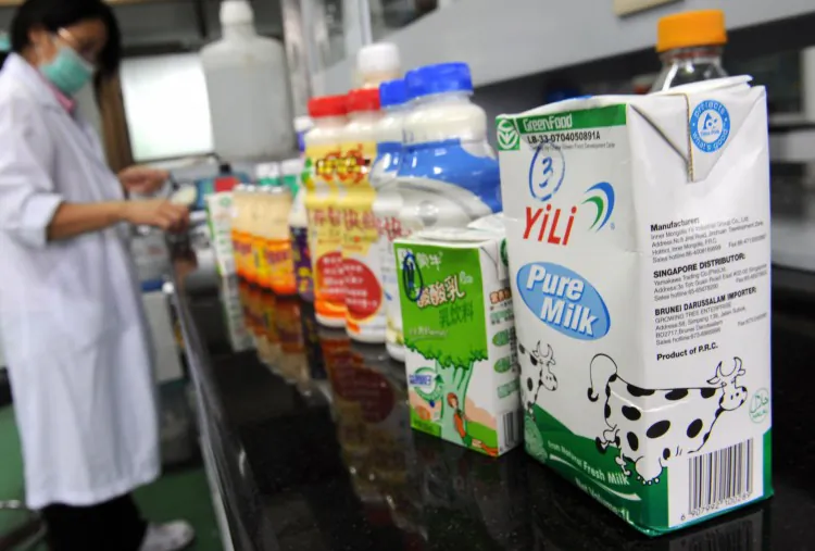 Mengniu Dairy Company Ltd milk products are seen during a press conference as the company presented their 2008 annual results in Hong Kong on April 16, 2009. After a recent announcement of high toxin levels in a batch of Mengniu’s milk, Chinese netizens have called for a boycott of the company. (Mike Clarke/AFP/Getty Images)