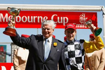 Bart Cummings and jockey Blake Shinn celebrate with the trophies after their horse Viewed won the Emirates Melbourne Cup during The Melbourne Cup Carnival meeting at Flemington Racecourse. (Quinn Rooney/Getty Images)