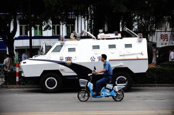 An armoured personel carrier, parked outside a Shenzhen police station that was the center of protests. (AFP/Getty Images)