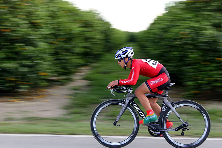 Mateo Sanchez, racing for LCTrainSmart/BurgerFI, accelerates at the start of his run on Saturday afternoon at the Chain of Lakes Cycling Classic time trial. (James Fish/The Epoch Times)