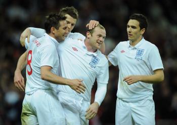 ROAD TO WORLD CUP: Wayne Rooney celebrates with his team mates after he scored during the International Friendly match between England and Slovakia at Wembley Stadium on March 28 (Shaun Botterill/Getty Images)