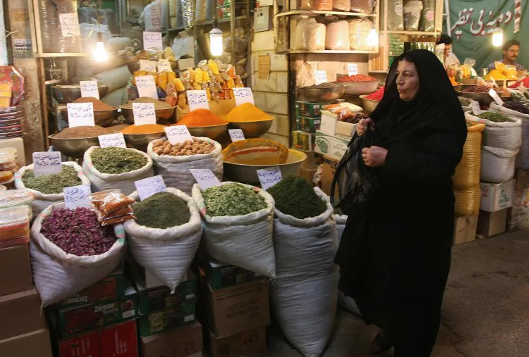 An Iranian woman shops at a bazaar in Isfahan, Iran, on July 7, 2009. (Ehsan Khosravi/AFP/Getty Images)