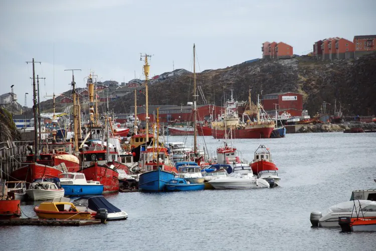 The port of Nuuk, capital of Greenland, July 6, 2009. Manufacturing could bring an influx of foreign workers to the Arctic island, heralding great change for the sparsely populated land. (Slim ALLAGUI/AFP/GettyImages)