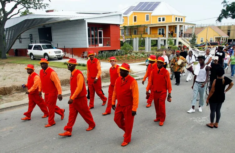 In this file photo, members of The Revolution Social Aid and Pleasure Club prepare to parade through the Lower 9th Ward to mark the fourth anniversary of hurricane Katrina on Aug. 29, 2009, in New Orleans, La. This week marks the seventh anniversary of Hurricane Katrina. (Sean Gardner/Getty Images)