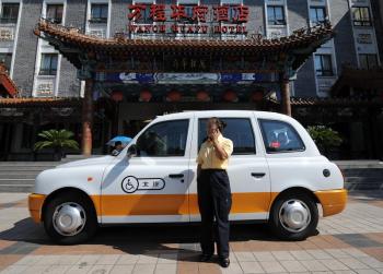 Currently 70,000 taxis in Beijing are equipped with a micro-monitor. The monitor connects to a GPS system via satellite. (Getty Images)