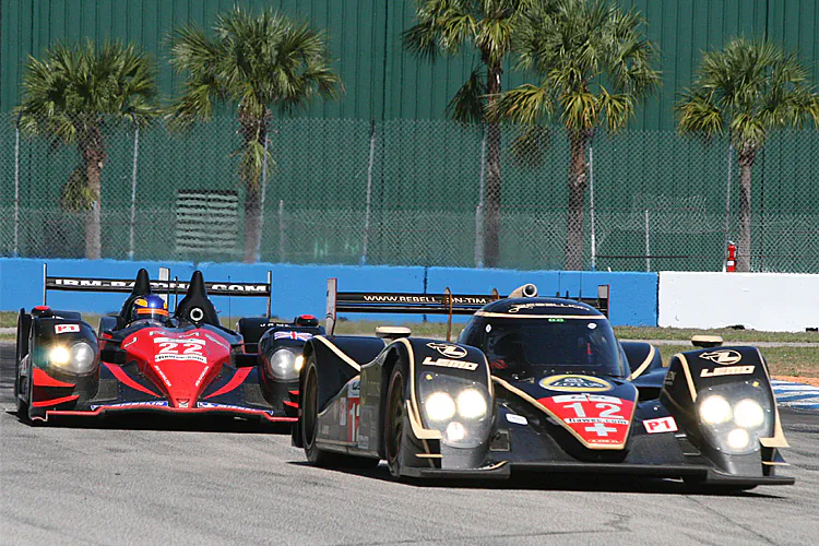 Cars like the 2012 Rebellion Lola (R) will be narrower, lighter, and will have a greater range of available engines for 2012. Open cars like the JRM HPD-ARX-03a will not be allowed. (James Fish/The Epoch Times)