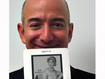 Amazon.com founder and chief executive Jeff Bezos holds an international Kindle electronic book reader, designed to make digital works easy to download wirelessly in countries around the world. (Glenn Champman/AFP/Getty Images)